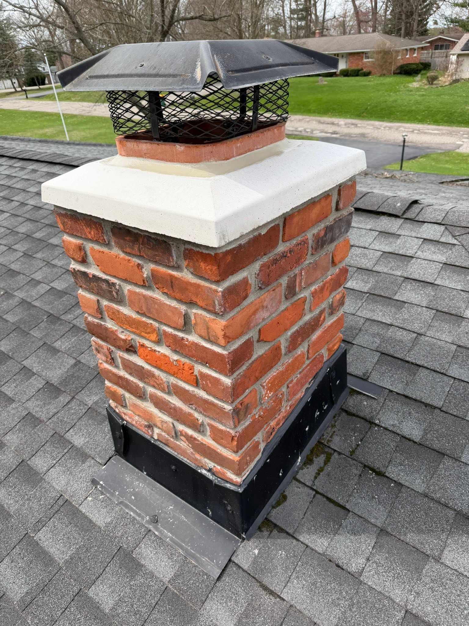 New brick chimney cap and flashing installed by masonry contractor in Genesee County, MI New brick chimney cap and flashing installed by masonry contractor in Genesee County, MI