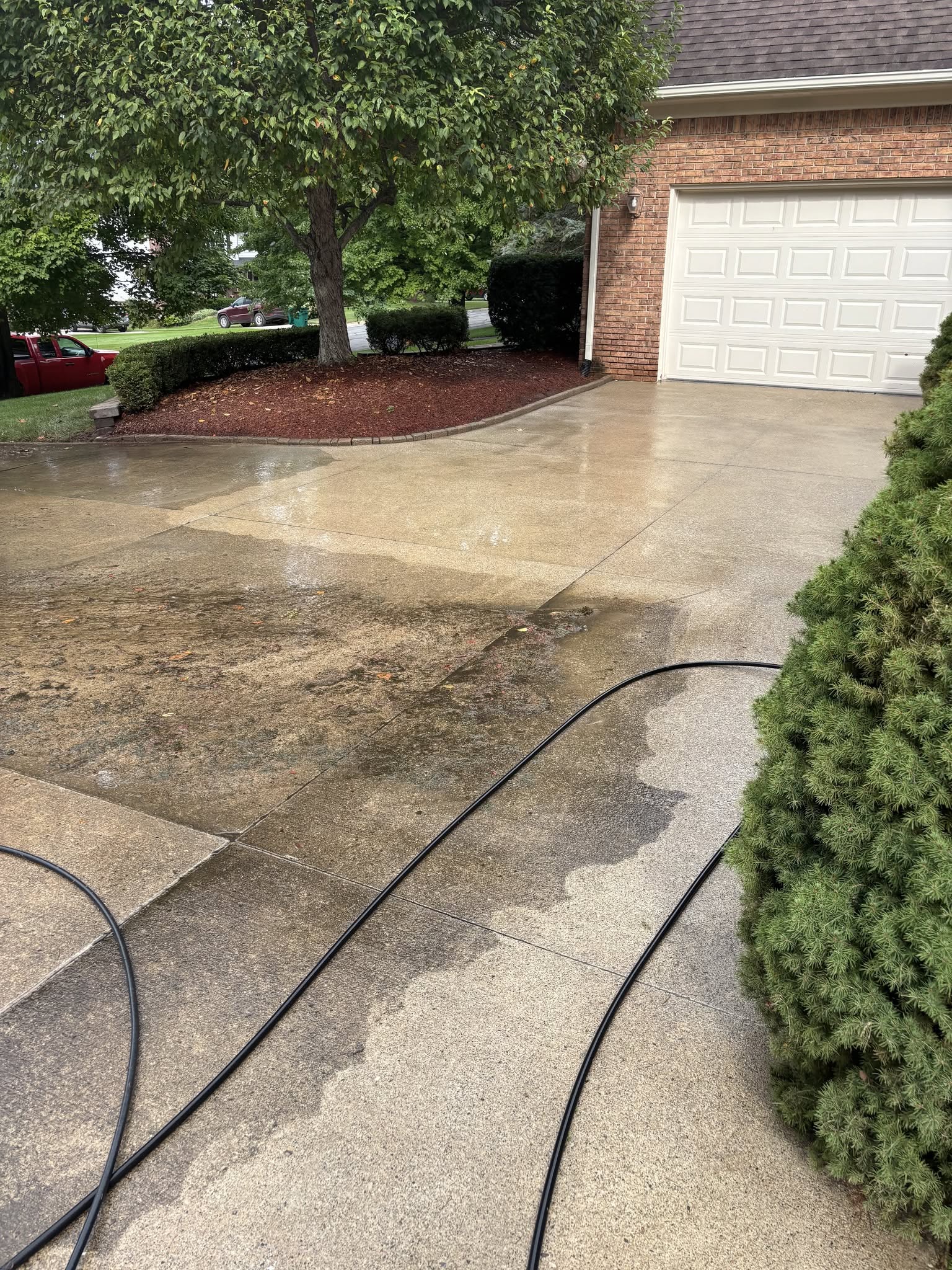 Driveway exterior maintenance and concrete cleaning in Fenton, MI by Jaybird Construction Driveway exterior maintenance and concrete cleaning in Fenton, MI by Jaybird Construction
