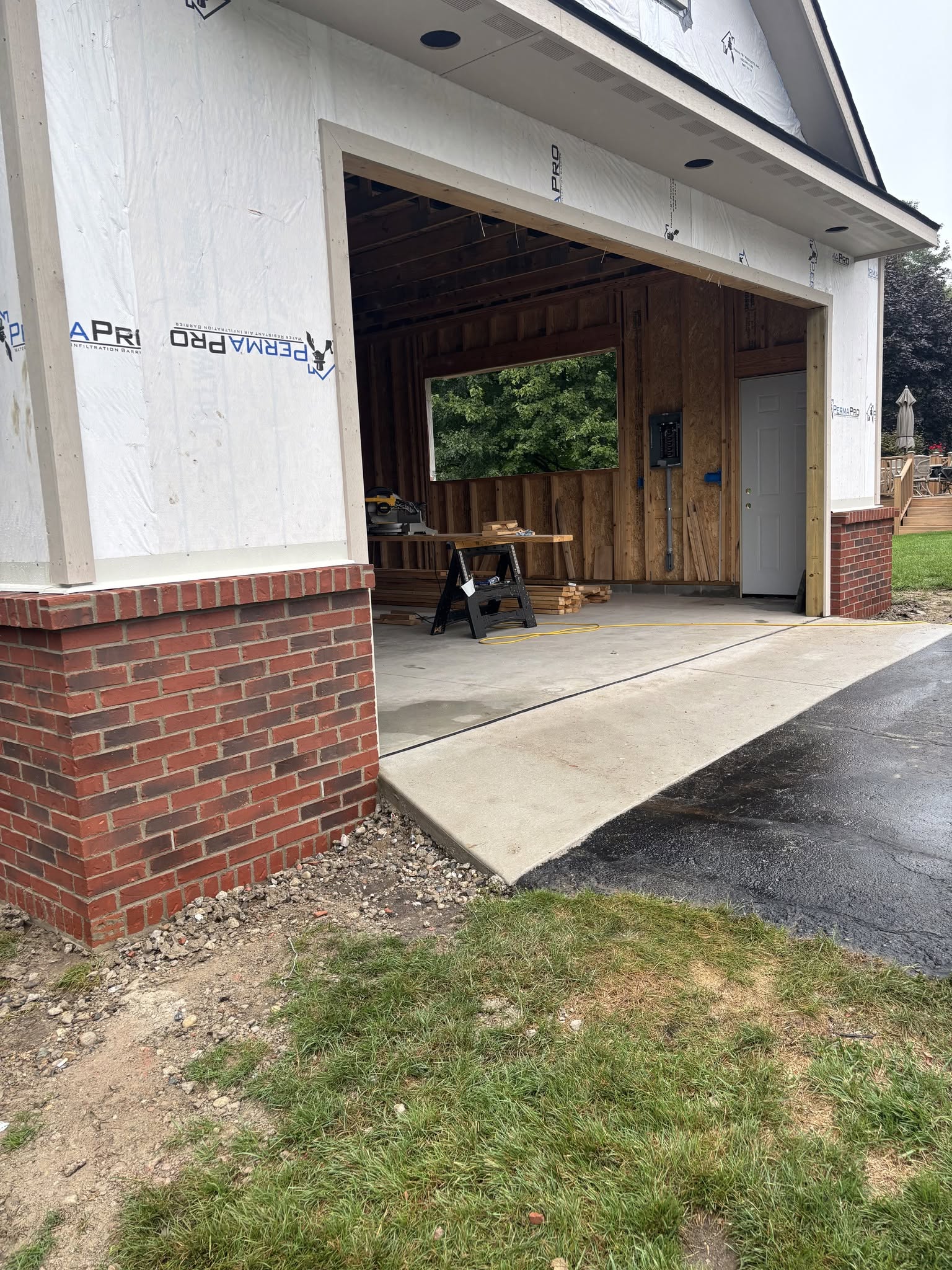 Residential garage framing and brick masonry in progress in Fenton, MI and Genesee County Residential garage framing and brick masonry in progress in Fenton, MI and Genesee County
